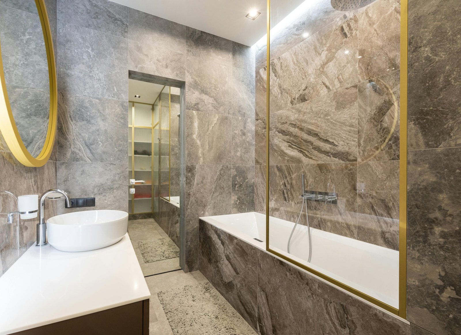 Richmond bathroom featuring custom shampoo niche and waterproofed shower walls