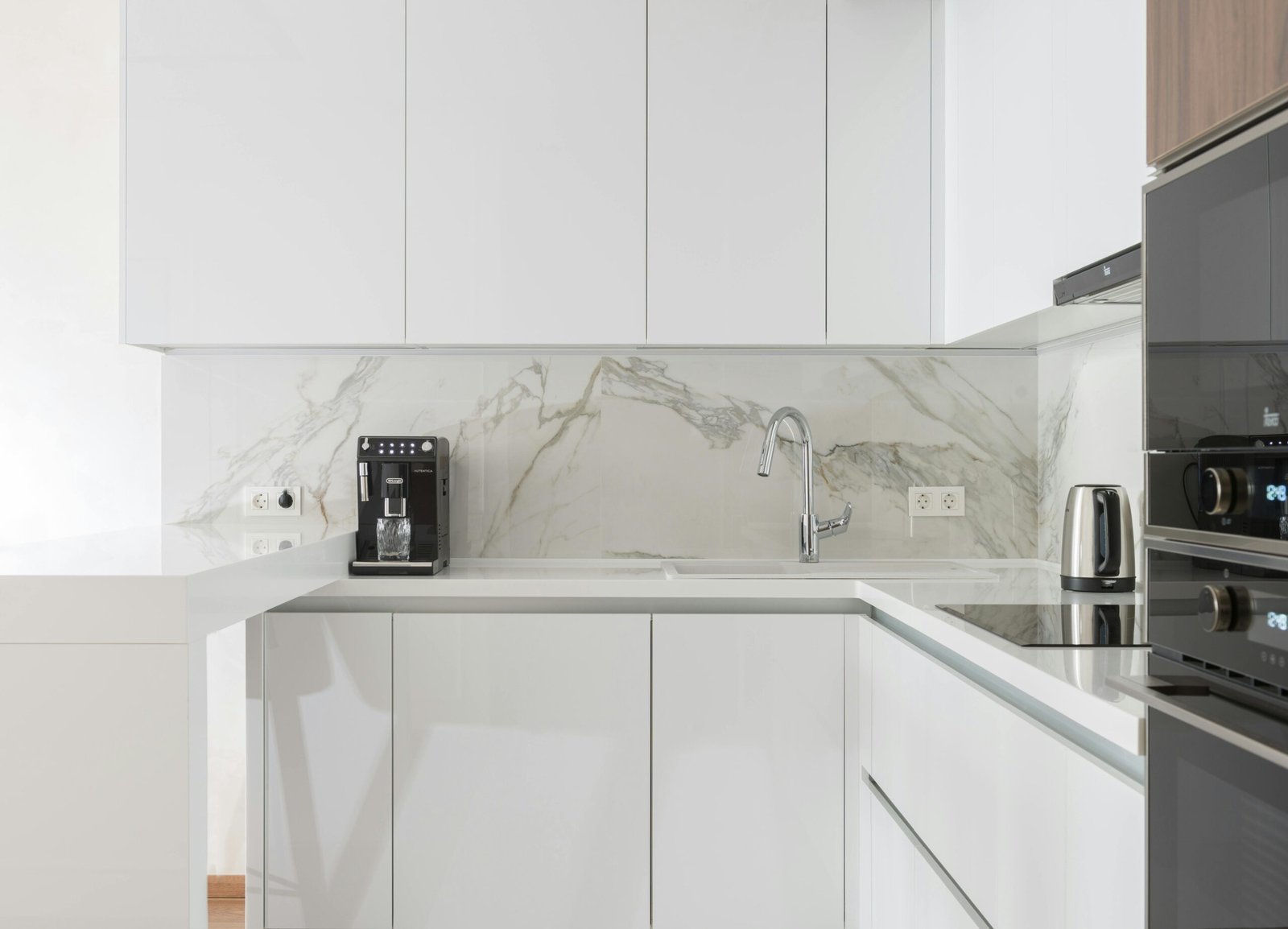 Full-height porcelain slab backsplash in Vancouver kitchen