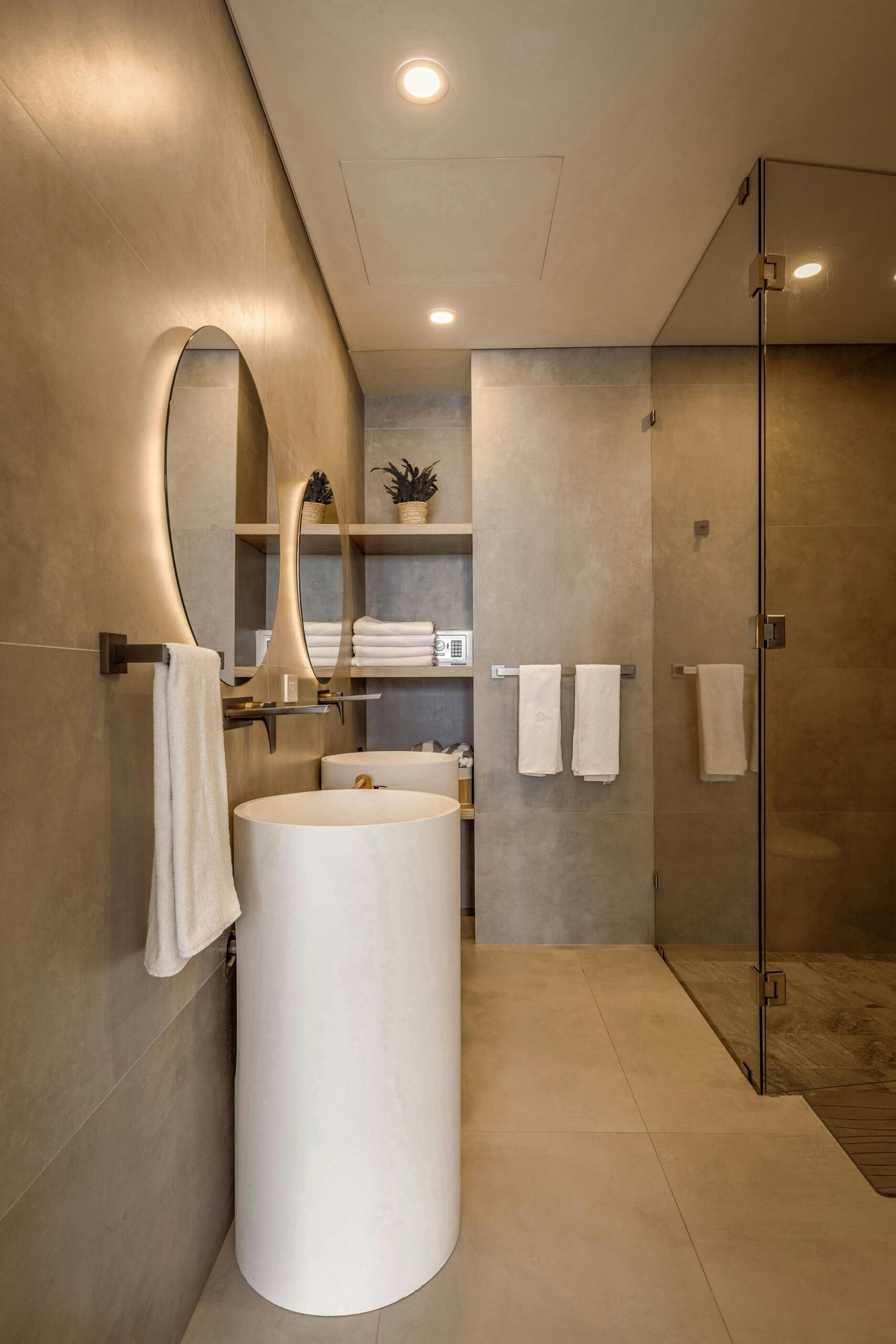 Bookmatched porcelain slab feature wall with mitered niche