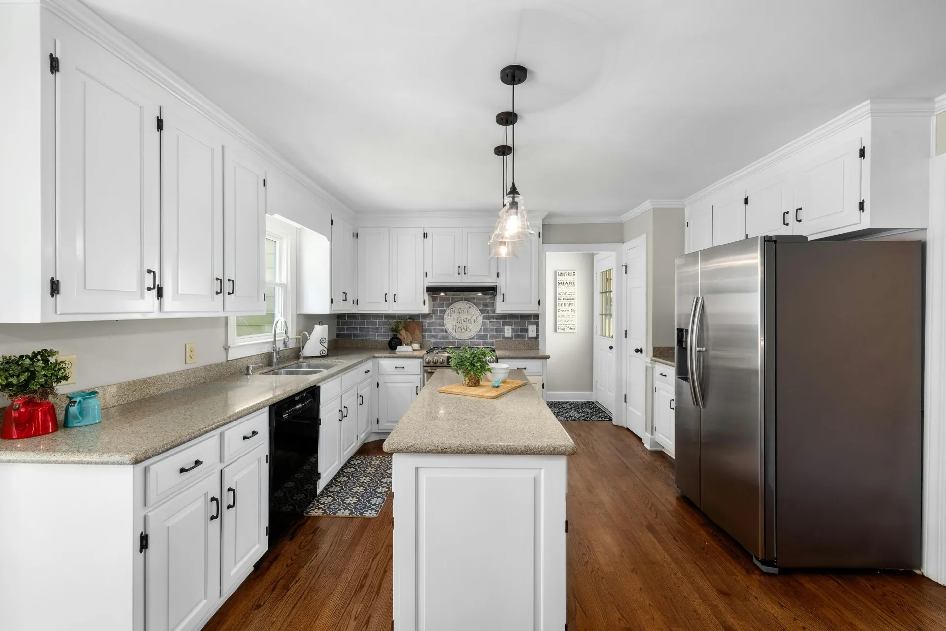 Warm kitchen with sand-toned quartz countertops and white cabinets